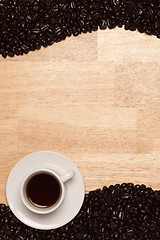 Image showing Dark Roasted Coffee Beans on Wood Background