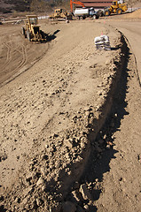 Image showing Sandbags & Machinery at Construction Site