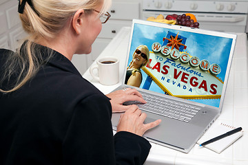 Image showing Woman In Kitchen Using Laptop - Las Vegas