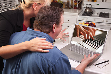 Image showing Couple In Kitchen Using Laptop - Music Performance