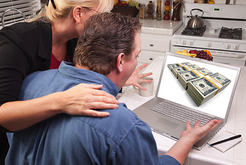 Image showing Couple In Kitchen Using Laptop - Money