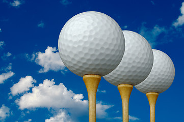 Image showing Three Golf Balls & Tees