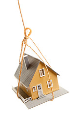 Image showing House Hanging by a String