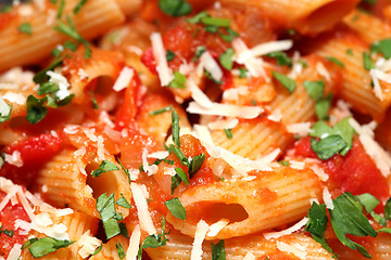 Image showing Penne rigate pasta with tomato sauce. background