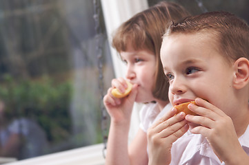 Image showing Sister and Brother Eating an Apple