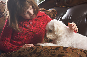 Image showing Young Girl with Her Maltese Puppy