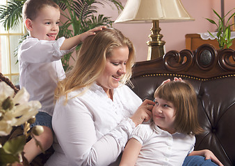 Image showing Mother and Children on The Couch