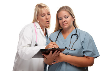 Image showing Two Doctors or Nurses Looking of File on Clipboard