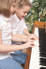 Image showing Children Playing the Piano