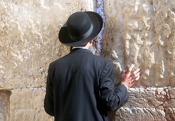 Image showing Orthodox man prayers at Western wall of Jerusalem 