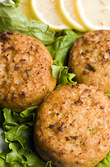 Image showing lobster cakes with lemon wedges tartar sauce