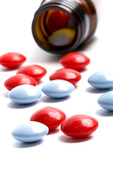 Image showing bottle with red and blue pills