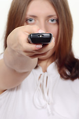 Image showing The nice girl with a control panel electronics