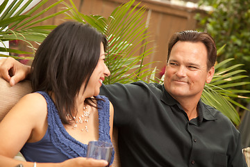 Image showing Attractive Hispanic and Caucasian Couple Drinking Wine