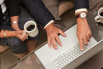 Image showing Man and Woman Using Laptop with Coffee