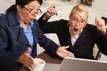 Image showing Businesswomen Celebrate Success on the Laptop