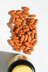 Image showing Pills next to a Container