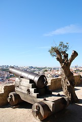 Image showing Cityscape of Lisbon in Portugal with cannon weapon