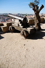 Image showing Cityscape of Lisbon in Portugal with cannon weapon