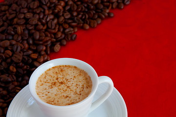 Image showing cup with coffee and grain expressed on red background