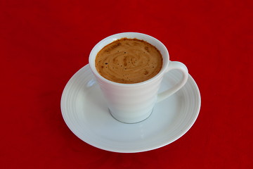 Image showing cup with coffee and grain expressed on red background