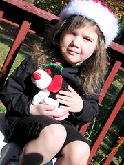 Image showing Cute little girl in santa hat outside