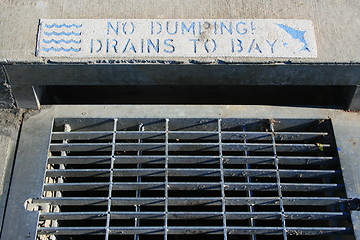 Image showing No Dumping Drains to Bay Sign