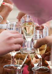 Image showing Glasses of champagne clinking.