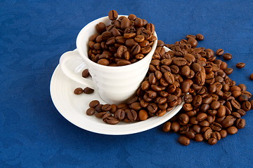 Image showing cup with coffee and grain expressed on blue background