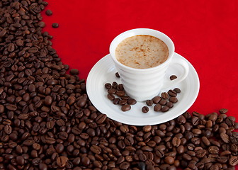 Image showing cup with coffee and grain expressed on red background