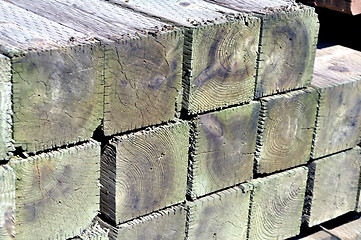 Image showing Stack of wooden posts