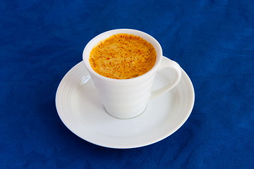 Image showing Cup of  coffee on a blue background