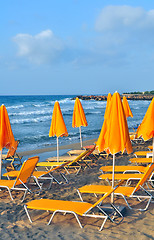 Image showing Sunbeds and beach umbrellas