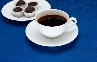 Image showing Cup of  coffee on a blue background