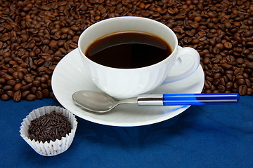 Image showing Cup of  coffee on a blue background