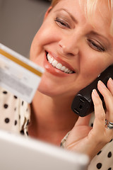 Image showing Beautiful Woman on Phone Holding Credit Card