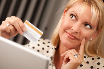 Image showing Beautiful Woman Using Laptop Holding Her Credit Card