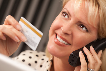 Image showing Beautiful Woman on Phone Holding Credit Card