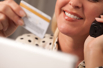 Image showing Beautiful Woman on Phone Holding Credit Card