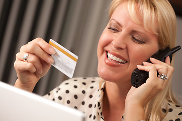 Image showing Beautiful Woman on Phone Holding Credit Card