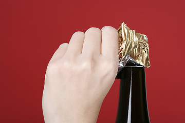 Image showing Opening champagne bottle