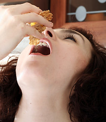 Image showing Young people eating milk with cereals