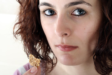 Image showing Young people eating milk with cereals