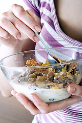 Image showing Young people eating milk with cereals