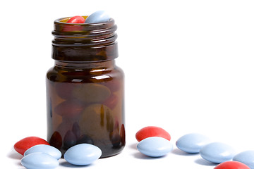 Image showing bottle with red and blue pills