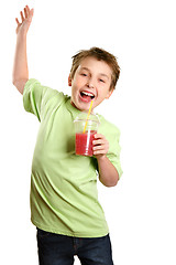 Image showing Jumping child holding healthy fruit juice