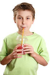 Image showing Child drinking a juice