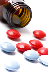 Image showing bottle with red and blue pills