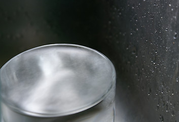 Image showing A glass of water within a steel metal water splashed environment