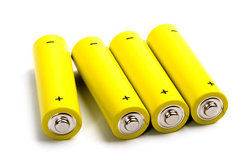 Image showing four yellow alkaline batteries